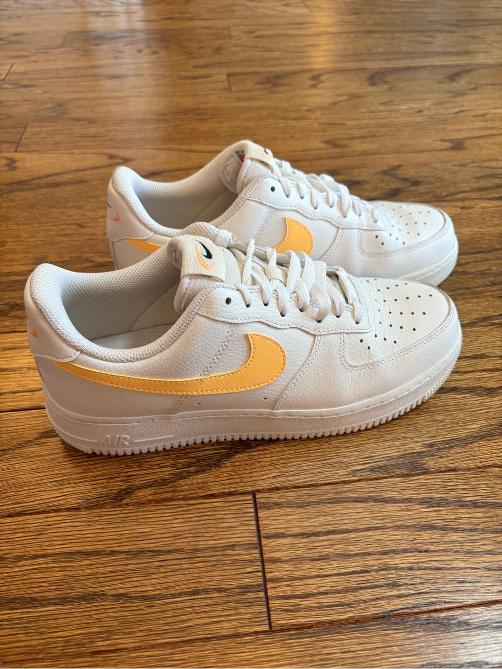 Nike Air Force 1 Sneakers in White with Neon Orange Swoosh